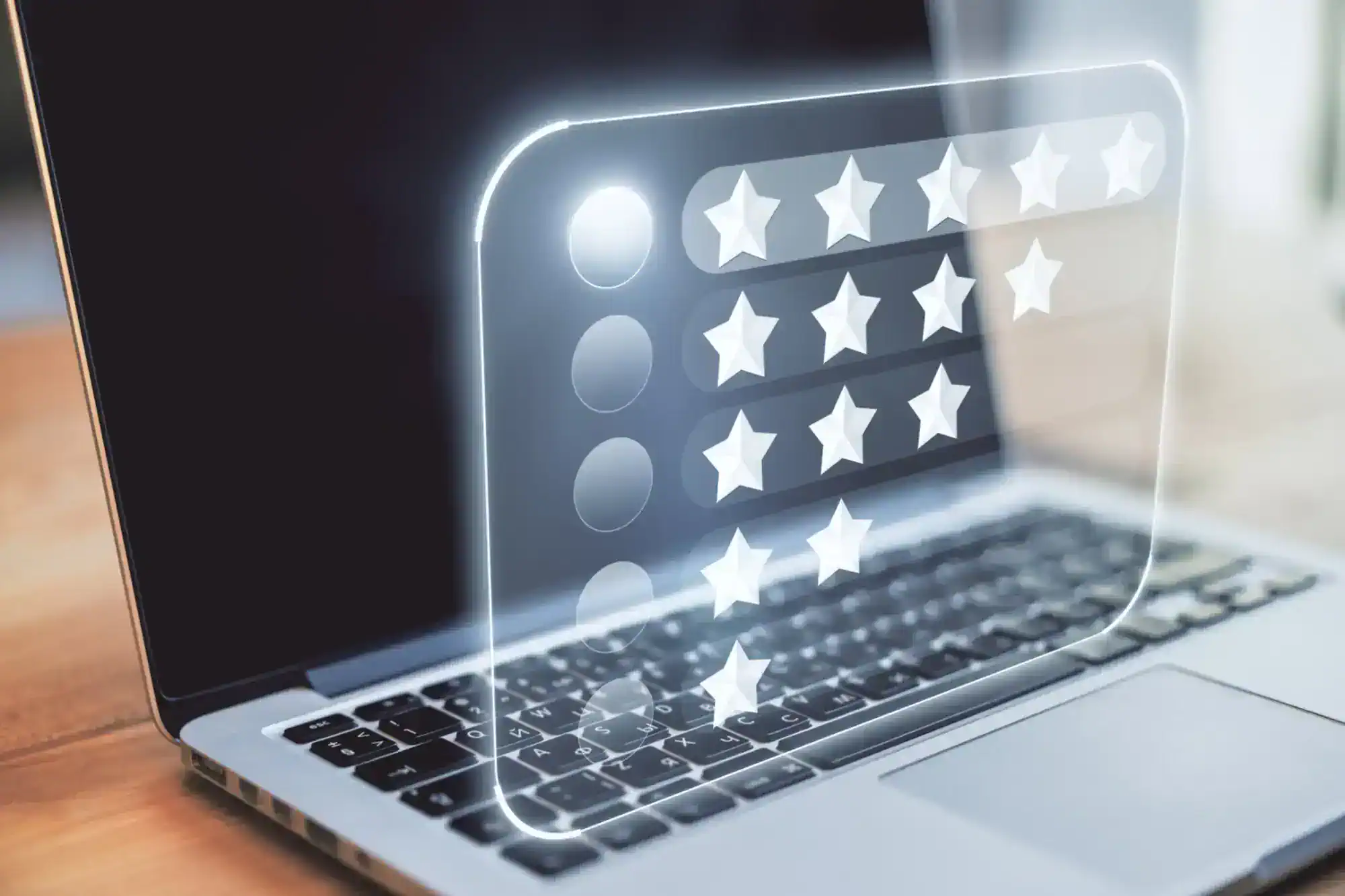 Laptop on a desk with a transparent review interface overlay showing star ratings.