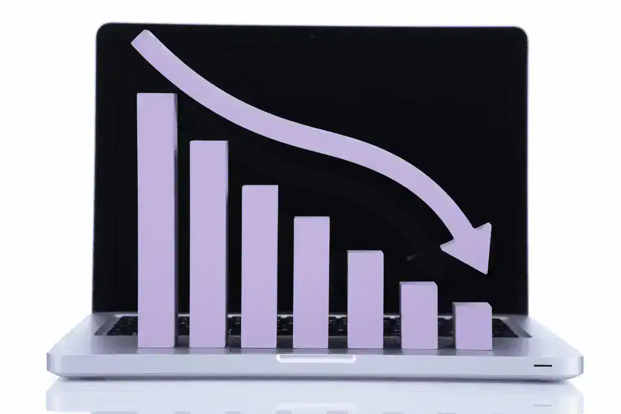 A graph showing bars and a downwards arrow.